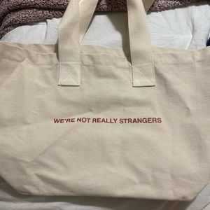 We’re Not Really Strangers tote bag
